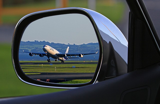 image of aeroplane in car wing mirro for blog on insulation for transportation by Elmelin