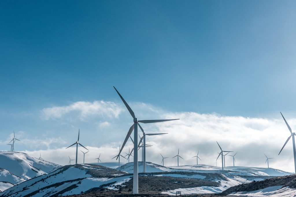 Imageof wind turbines in snow for World Environment Day blog by Elmeling, specialists in Mica based industrial insulation